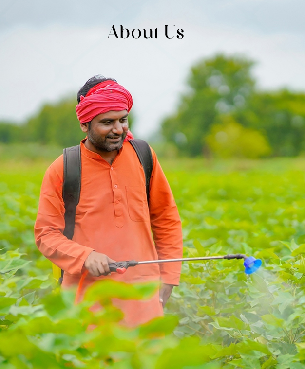 About Us Image: Farmer spraying in a field